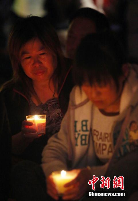 MH370航班失聯(lián)滿月 在京乘客家屬舉行祈?；顒?dòng)